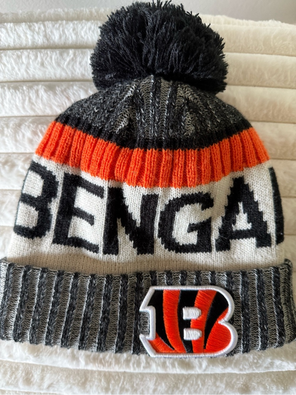 Cincinnati Bengals New Era NFL Pom Beanie Hat - Black, Orange, Gray.